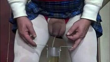 Crossdressing beauty swallows her partner's load in gay sex video