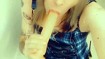 gorgeous tranny in lingerie sucks and touches her hard clitty.