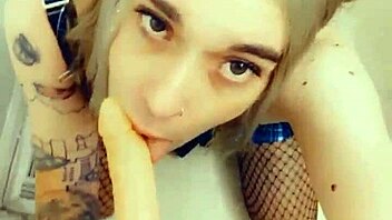 gorgeous tranny in lingerie sucks and touches her hard clitty.