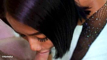 A couple enjoys an intimate session in their bedroom.