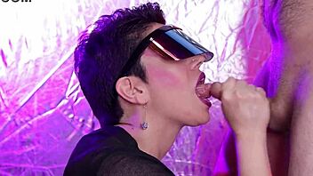 in a retro futuristic scene, she licks cum off his cock