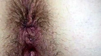 Intense pussy play bent over, leading to cum.