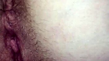 Intense pussy play bent over, leading to cum.