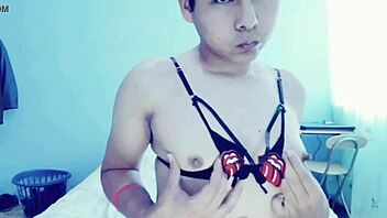 This hot young gay guy is touching himself in his room, and he's crossdressing too!