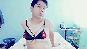 This hot young gay guy is touching himself in his room, and he's crossdressing too!