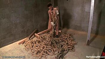 Interracial BDSM scene with ebony female submissive and white dominant