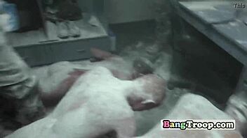 muscled soldiers groping in steamy shower orgy.