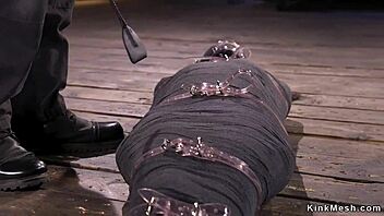 Mummified brunette gets whipped hard