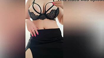 Busty woman in black skirt and seductive bra performs a tantalizing dance - luxuryorgasm