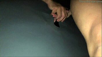 Red-clad couple teases with glory hole and cuckold in the night club
