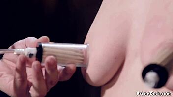 Blonde endures device bondage zipper treatment