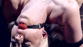 Blonde endures device bondage zipper treatment