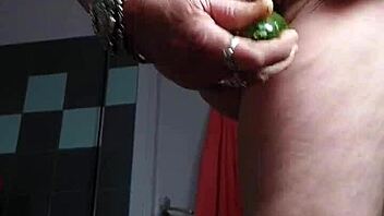 German Granny Teases Hairy Slit with Cucumber Play