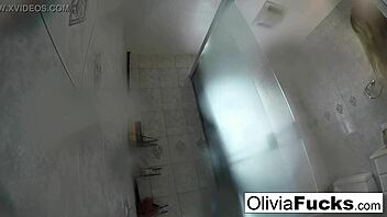 Sensual pierced beauty Olivia Austin cleans up after a day