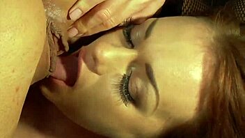 Two beautiful brunettes enjoy lesbian sex with a golden dildo and perform oral sex.