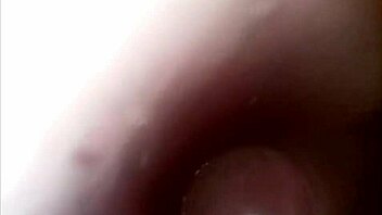 camera captures her pussy up close during intense dildo play