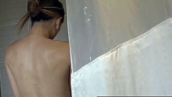 tranny venus lux with huge tits washes up while stroking herself in the bath.