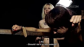 bound girl gets whipped with candle play on her