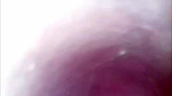 camera captures her pussy up close during intense dildo play