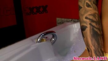 this solo shemale jerks off in the bath, feeling so good