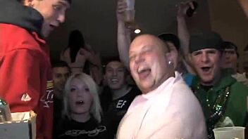 Coed lesbians tease and dildo each other at university party while everyone watches