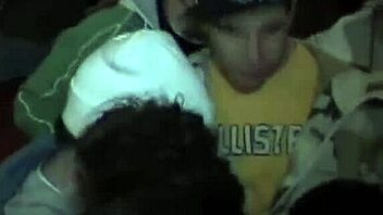 Coed lesbians tease and dildo each other at university party while everyone watches