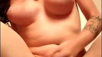 the tranny is fucking her ass with a dildo hard