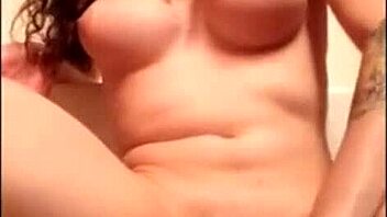 the tranny is fucking her ass with a dildo hard