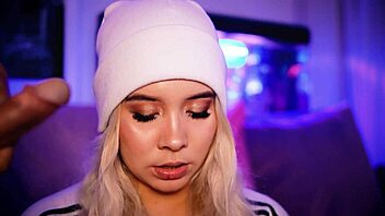 Cute blonde sucks cock close up