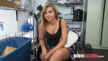 gorgeous chick getting drilled by director's big black cock against desk