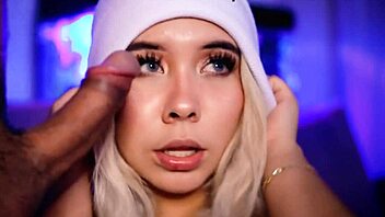 Cute blonde sucks cock close up