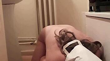 masked slave undergoes bdsm training session