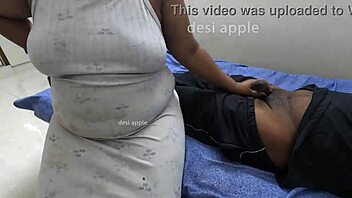 An Indian housewife gives a sensual massage to a man she does not know in a massage parlor.