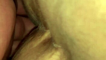 Nicholas performs striptease at night club, ripping tight clothes to expose pussy while dancing seductively.