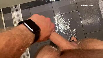 Gay guys cruise in gym shower for blowjobs and masturbation.