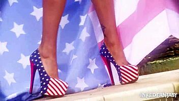 Beautiful inked goddess Daniela boldly teases and undresses in intense lesbian striptease