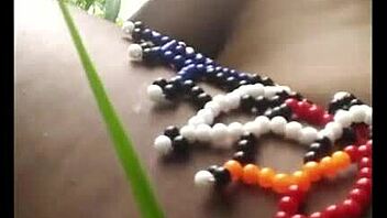 msanzi ebony model poses in lingerie outdoors