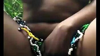 msanzi ebony model poses in lingerie outdoors