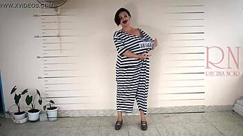 In the prison, a detained lady gets photographed while undressing for the camera in cosplay.