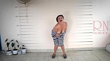 In the prison, a detained lady gets photographed while undressing for the camera in cosplay.