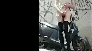 Beautiful shemale masturbates outdoors and squirts.