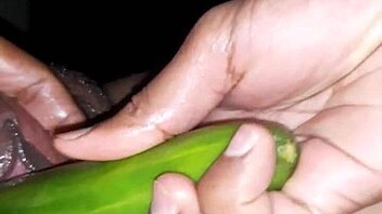 Beautiful Indian woman enjoying sex toys and cucumber on her oiled up body