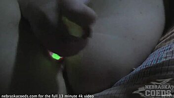 A beautiful blonde wearing glasses uses glowsticks to open up her tight vagina in this director's cut.