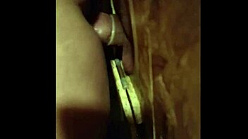 She sucks cock through the GLORY HOLE