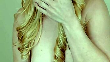 A muscular blonde domme humiliates a man with small biceps.