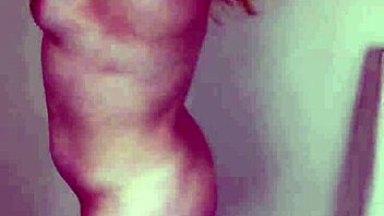 A muscular blonde domme humiliates a man with small biceps.