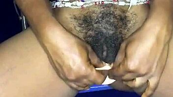 Watch this sexy ebony from Ghana satisfy herself with a dildo in her anal and pussy holes!