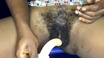 Watch this sexy ebony from Ghana satisfy herself with a dildo in her anal and pussy holes!