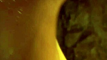 Asian brunette babe teases and strips naked while dancing