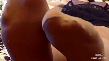 Close up of sweaty feet in dirty pantyhose and leggings